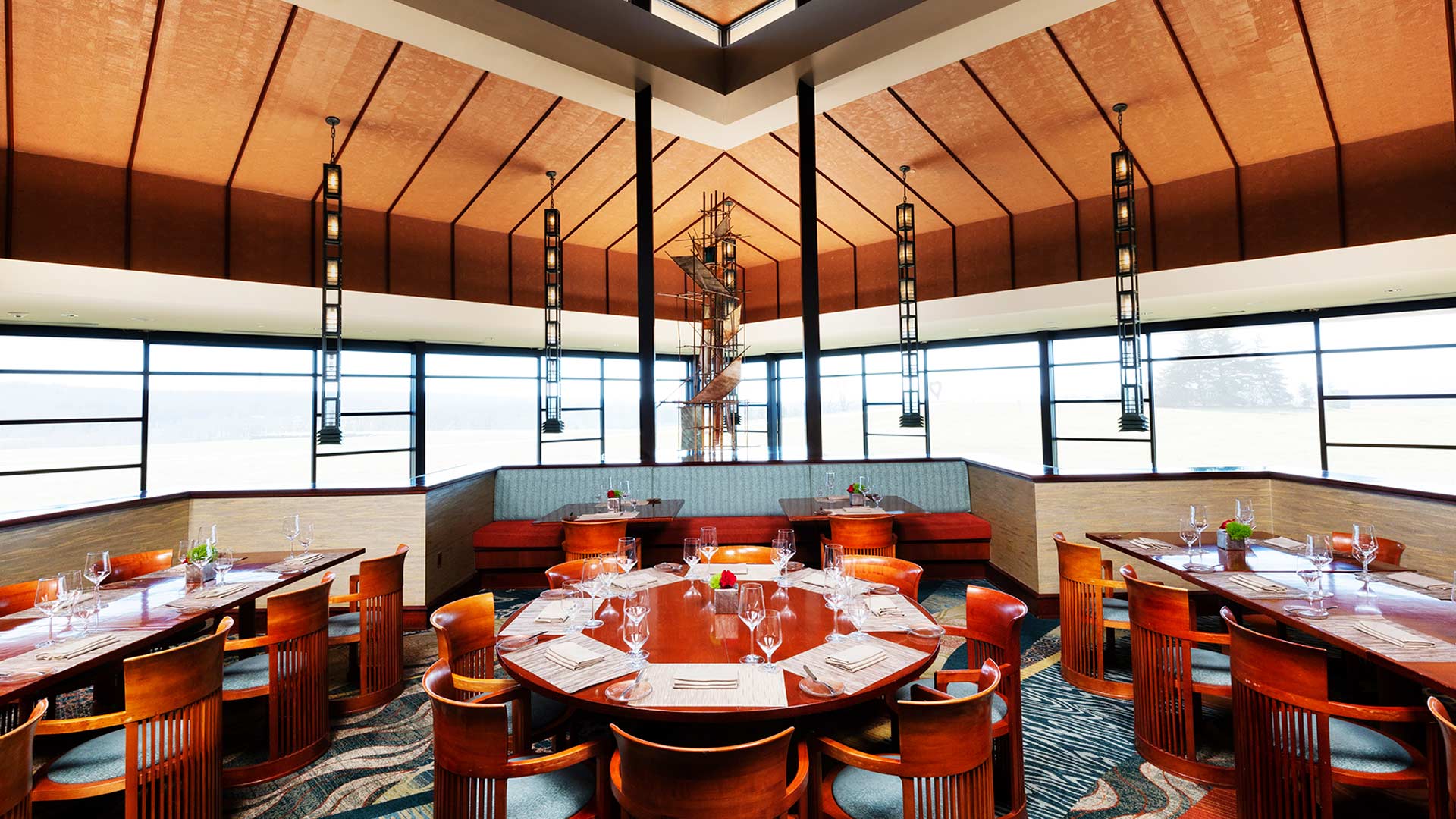 Large restaurant setting with lots of seating and large windows