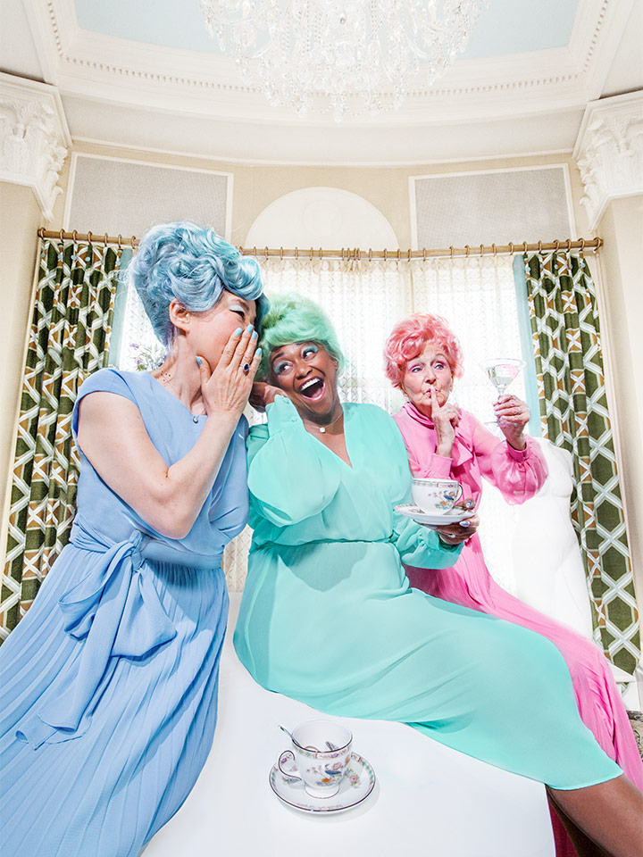 Women enjoying drinks in colorful outfits
