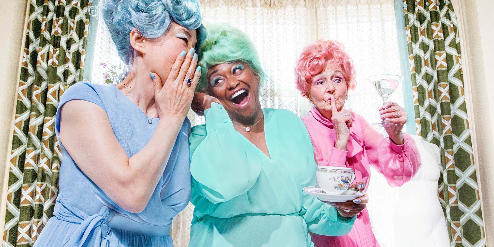Women enjoying drinks in colorful outfits