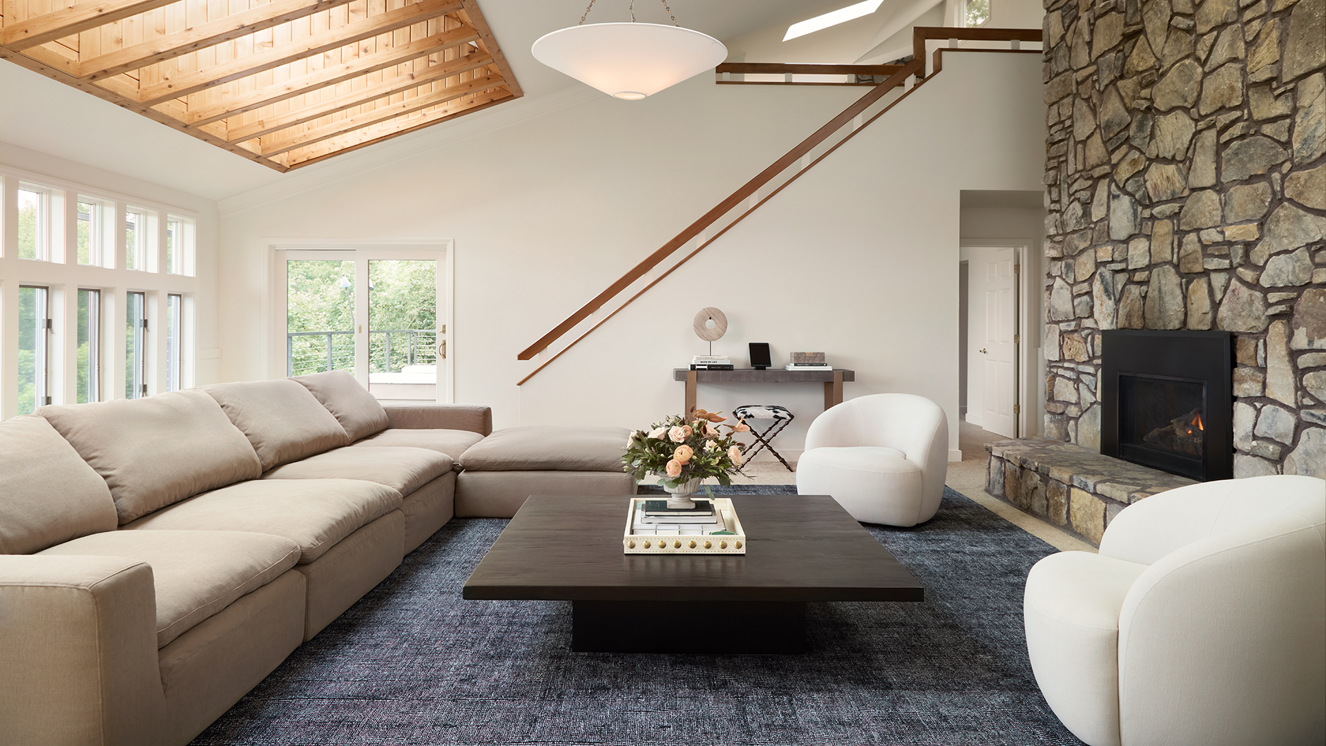 Living room of a house with wooden table and white chair