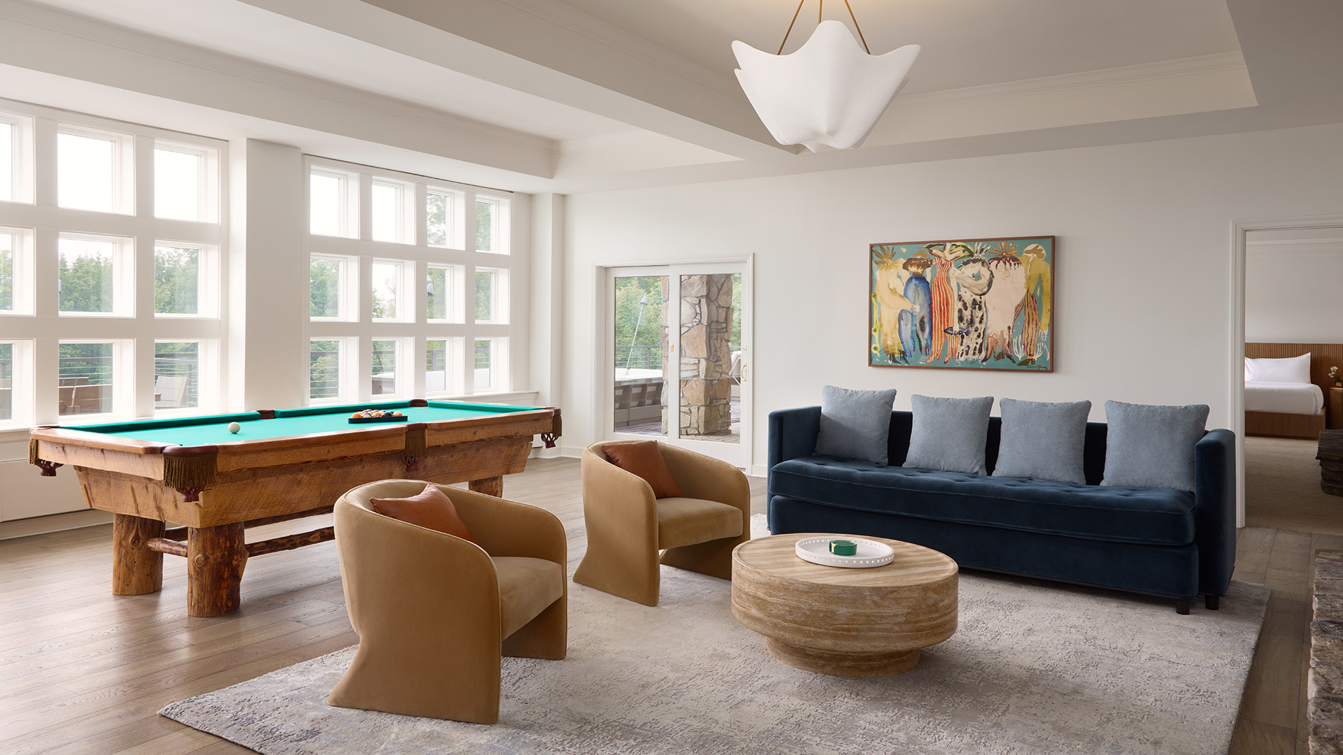 game room with pool table and couches