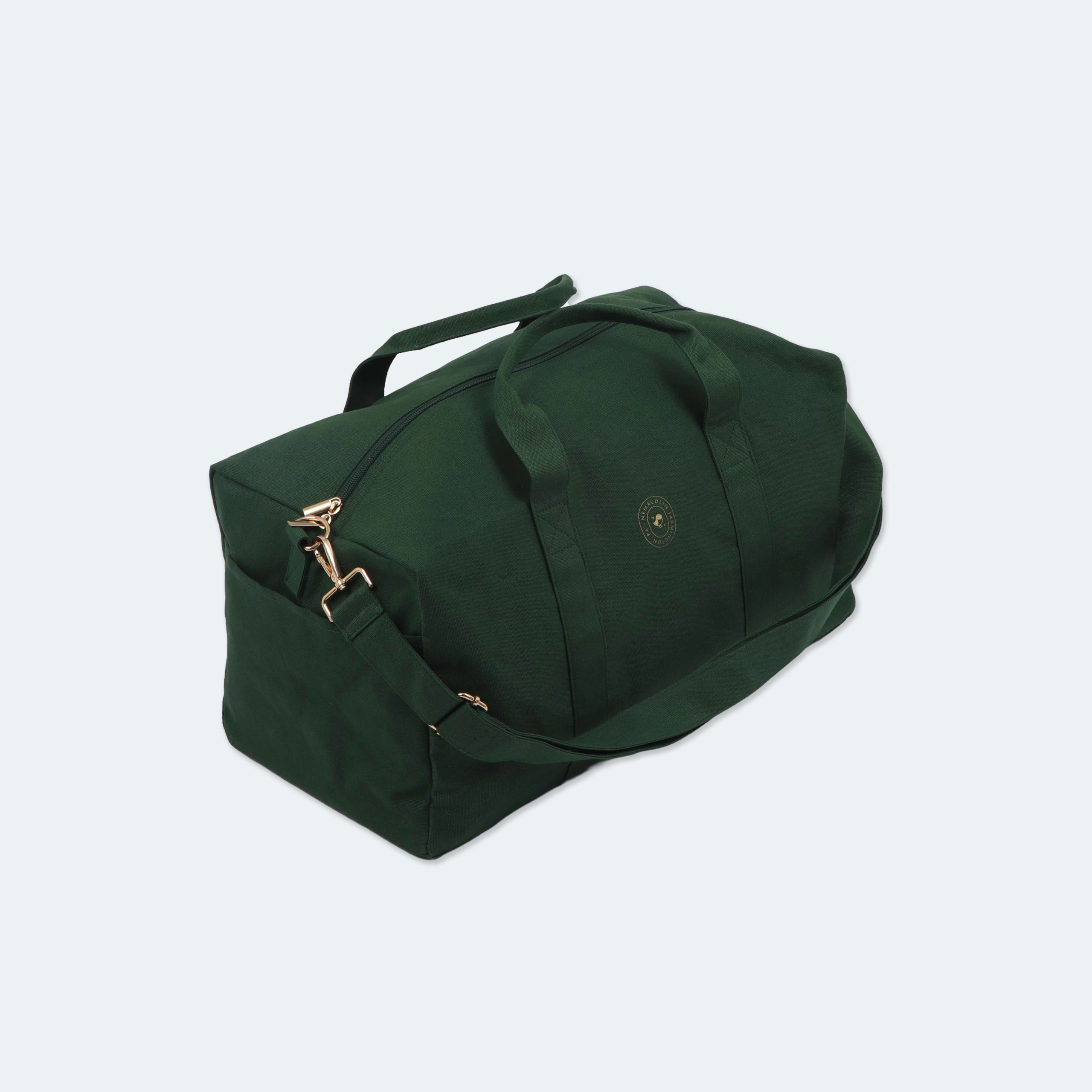 green duffel bag with Nemacolin resort logo