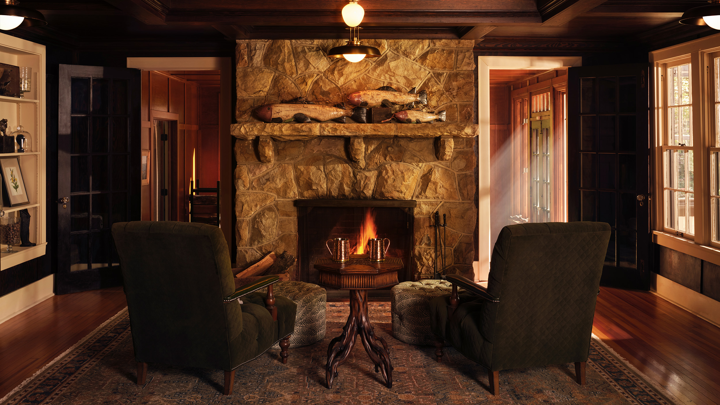 Living room with a fireplace in a cabin