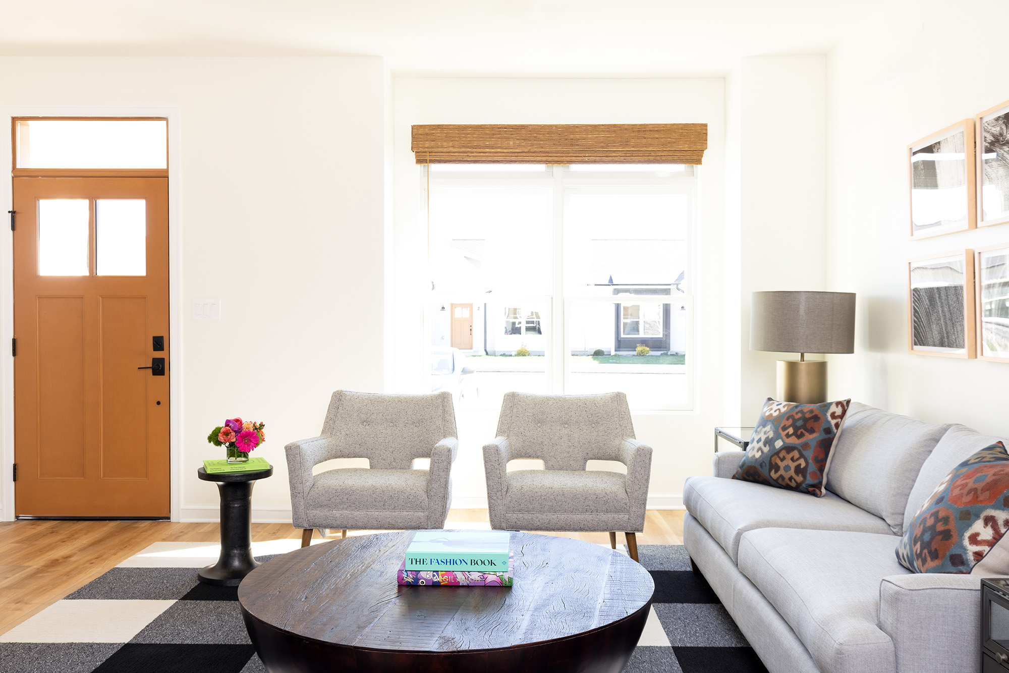 living room with white couch and chairs, and coffee table