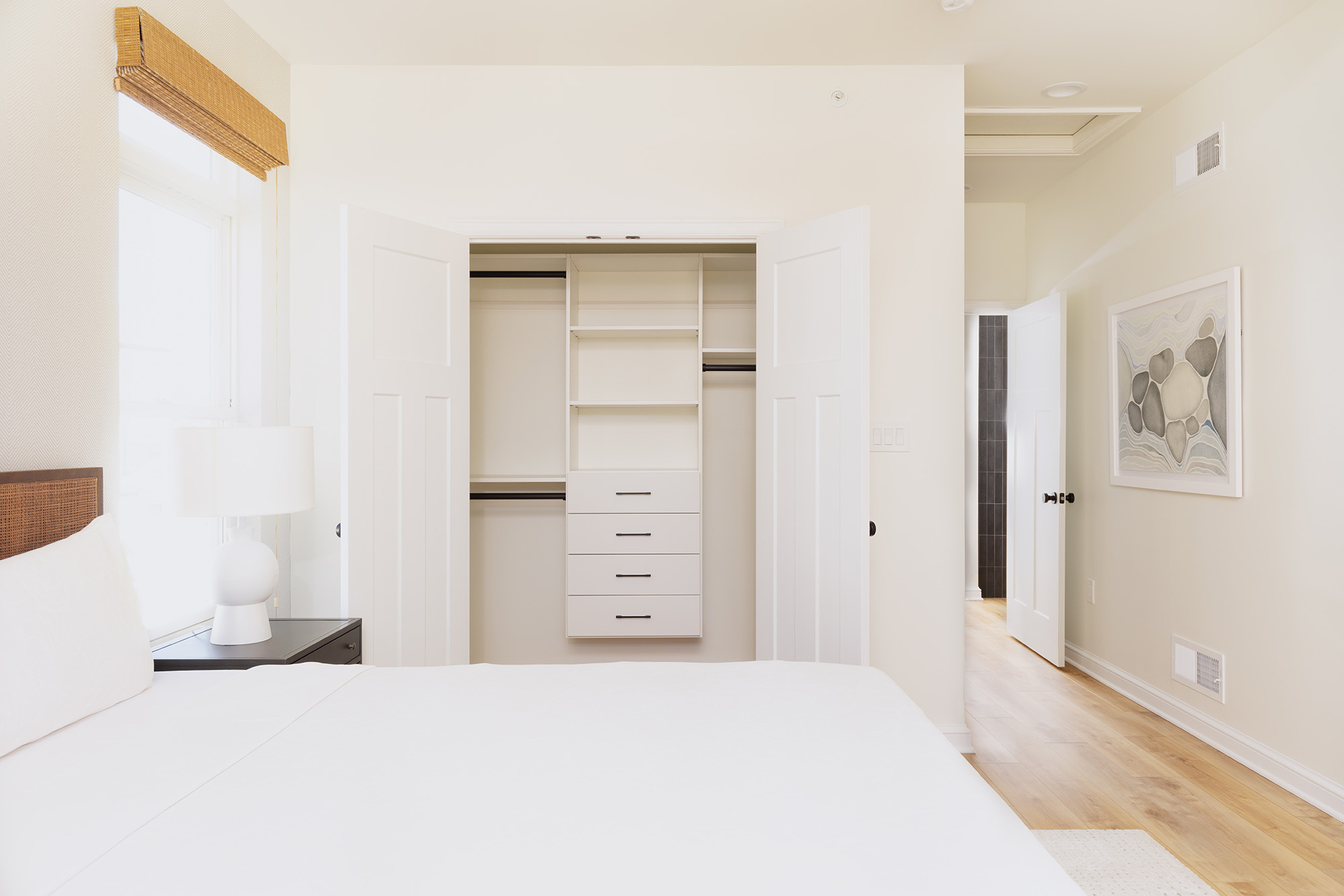 Bedroom with bed with white sheets