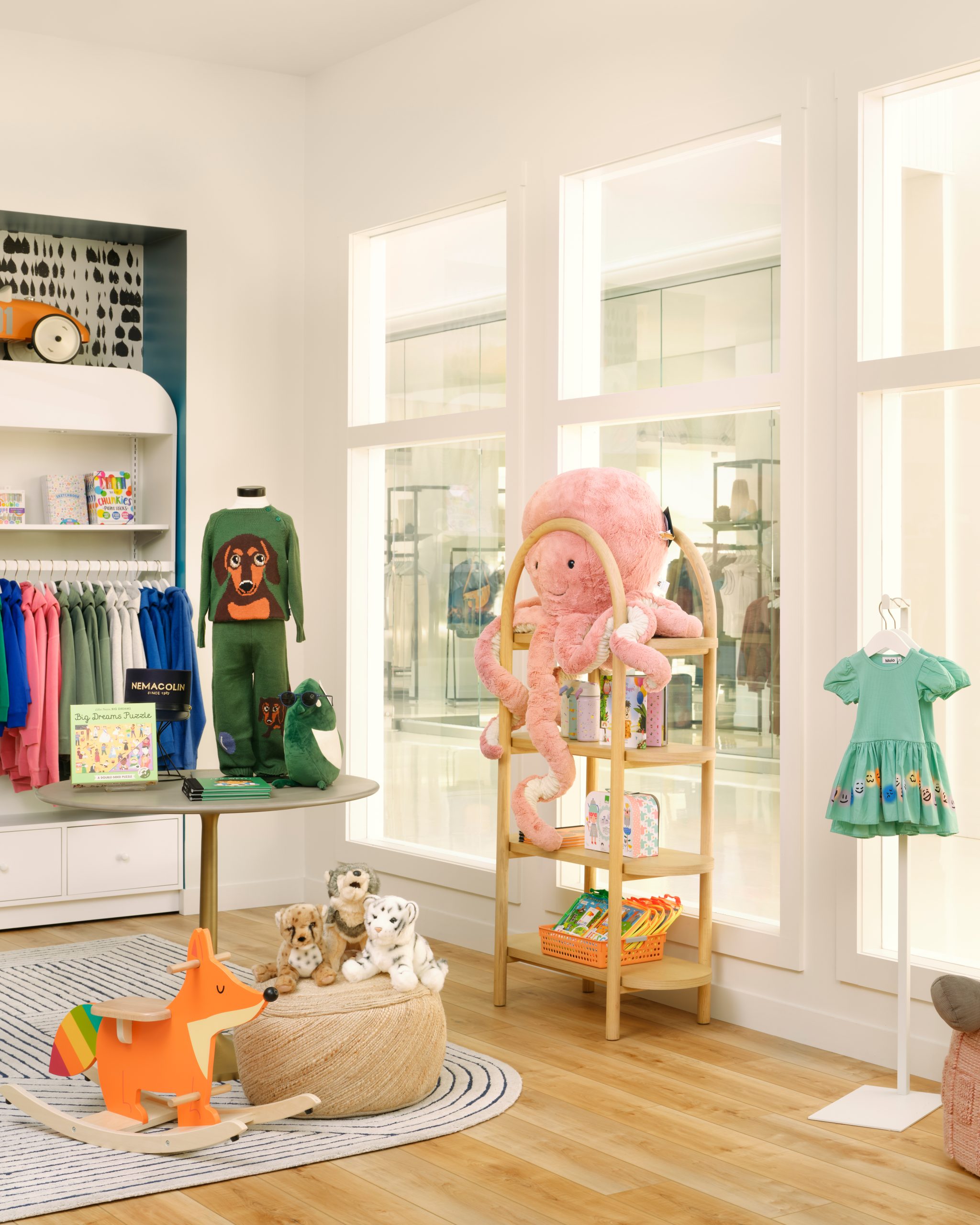 kids retail shop with pink octopus stuffed animal and clothing