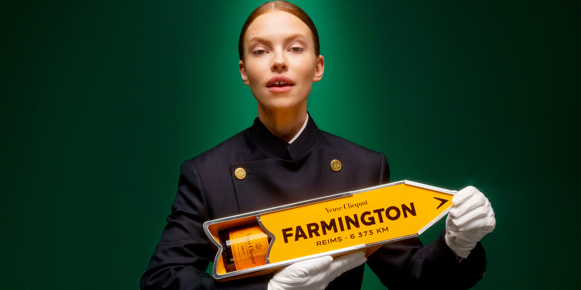 Butler holding a bottle of champagne